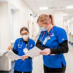 Student nurses comparing paperwork on January 25, 2022